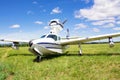 Little airplane on green grass field