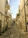 Little alley in the medieval white village of Ostuni