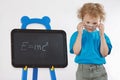 Little amazed boy with glasses shows formula Royalty Free Stock Photo