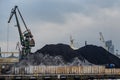 Little ammount of black coal in the sea port. Royalty Free Stock Photo