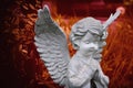 Little angel praying. Red hot style concept children`s mortality, ÃÂ°pocalypse Royalty Free Stock Photo