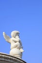 Little Angel Sculpture in the Blue Sky Background Royalty Free Stock Photo