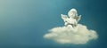 Little angel sitting on the cloud and reading book Royalty Free Stock Photo