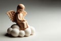 A little angel sitting on a cloud. Space for text. Royalty Free Stock Photo