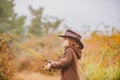 Little angler fishing on lake. Family and generation - autumn holidays and people concept. Royalty Free Stock Photo