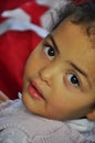 Little arabic girl with red tunisian flag Royalty Free Stock Photo