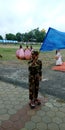 Little army solider scating with flag holding Royalty Free Stock Photo