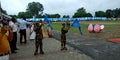 Little army solider scating on ground during an Independence Day program