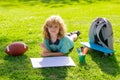 Little artist drawing painting art in park. School kid drawing in summer park, painting art. Little painter draw Royalty Free Stock Photo