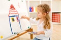 Little artist girl with her masterpiece Royalty Free Stock Photo