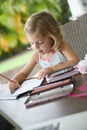 Little artist girl making drawings Royalty Free Stock Photo