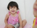 Little Asian baby girls smiling and laughing at home Royalty Free Stock Photo