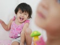 Little Asian baby girls smiling and laughing at home Royalty Free Stock Photo