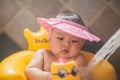 Little asian babe is having fun in the shower Royalty Free Stock Photo