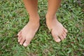 little asian boy feet on green grass Royalty Free Stock Photo