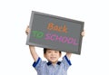 Little Asian boy holding chalkboard over white background Royalty Free Stock Photo