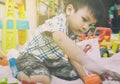 Little Asian boy playing in a sandbox. Royalty Free Stock Photo