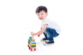 Boy playing toy on the floor over white background Royalty Free Stock Photo