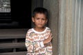 Little asian boy posing in Angkor Wat temple