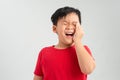 Little Asian boy suffering from toothache - Dental problem Royalty Free Stock Photo