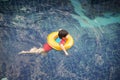 Little boy in the swimming pool with rubber ring Royalty Free Stock Photo