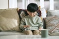 little asian boy using digital tablet at home Royalty Free Stock Photo