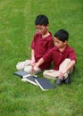 Little asian boys with books