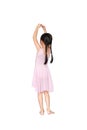 Little Asian child girl ballerina in pink leotard isolated on Cyan background. Kid practise her dance. Children ballet dancer rear Royalty Free Stock Photo