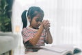 Little asian child girl praying for god at home Royalty Free Stock Photo