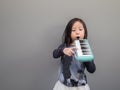 Little asian child play the melodion Royalty Free Stock Photo