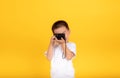 Little asian children boy photographer learning holding digital camera taking a photo shoot