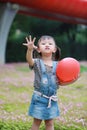 Aisa cute naughty lovely child girl with V pose play with balloon have fun outdoor in summer park happy smile happiness childhood Royalty Free Stock Photo