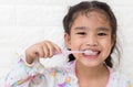 Little asian cute girl brush teeth