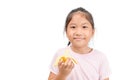 Little asian cute girl eats banana isolated on white Royalty Free Stock Photo