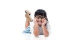 Little Asian cute girl laying on the floor isolated with clipping path. Royalty Free Stock Photo