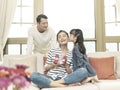 Little asian girl kissing mother on the cheek Royalty Free Stock Photo