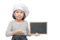 Little asian girl chef in uniform cook holding blackboard Royalty Free Stock Photo