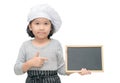 Little asian girl chef in uniform cook holding blackboard Royalty Free Stock Photo