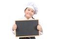 Little asian girl chef in uniform cook holding blackboard for in put text or menu, isolated Royalty Free Stock Photo