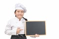 Little asian girl chef in uniform cook holding blackboard for in put text or menu Royalty Free Stock Photo