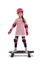 Little Asian girl child skating on a skateboard isolated on white background. Kid riding on skateboard with Clipping path Royalty Free Stock Photo