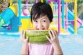 Little Asian girl eating fresh watermelon Royalty Free Stock Photo