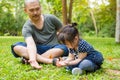 Little girl and her father looking at butterflies