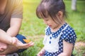 Little girl and her father looking at butterflies