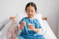 little asian girl in hospital gown Royalty Free Stock Photo