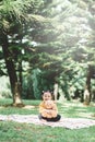 Little asian girl hugging her teddy bear in a park. Royalty Free Stock Photo