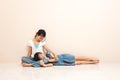 Little asian girl laying on her old sister at home. lovely relation between siblings Royalty Free Stock Photo