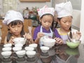 Little asian girl making cotton wool cake Royalty Free Stock Photo