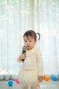 Little asian girl with microphone Royalty Free Stock Photo