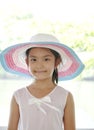 Little Asian Girl outdoors in summer hat Royalty Free Stock Photo